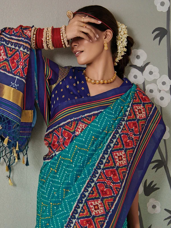 Wedding wear rama green patola silk saree