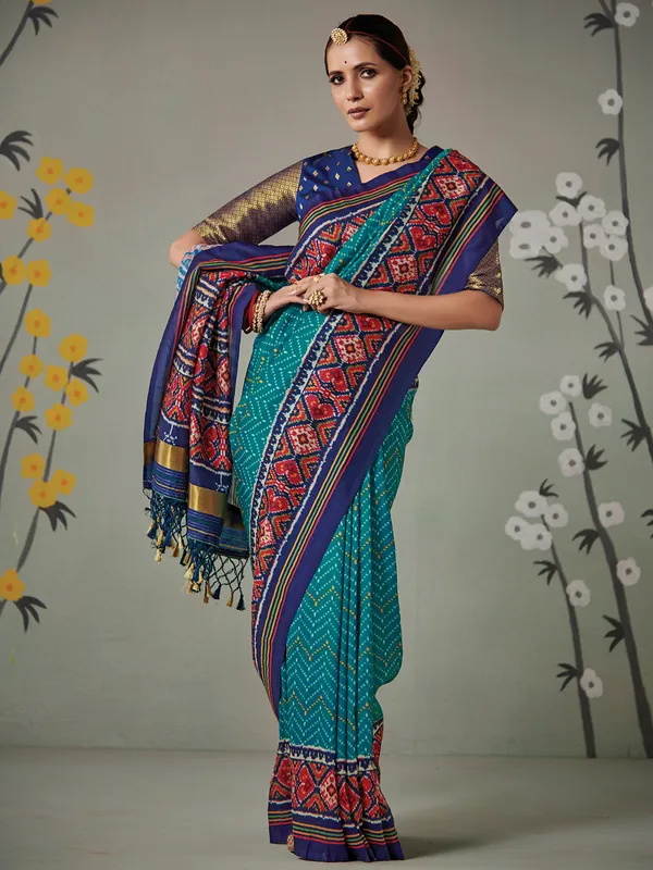 Wedding wear rama green patola silk saree