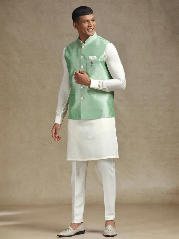 White and light green waistcoat set with intricate embroidery
