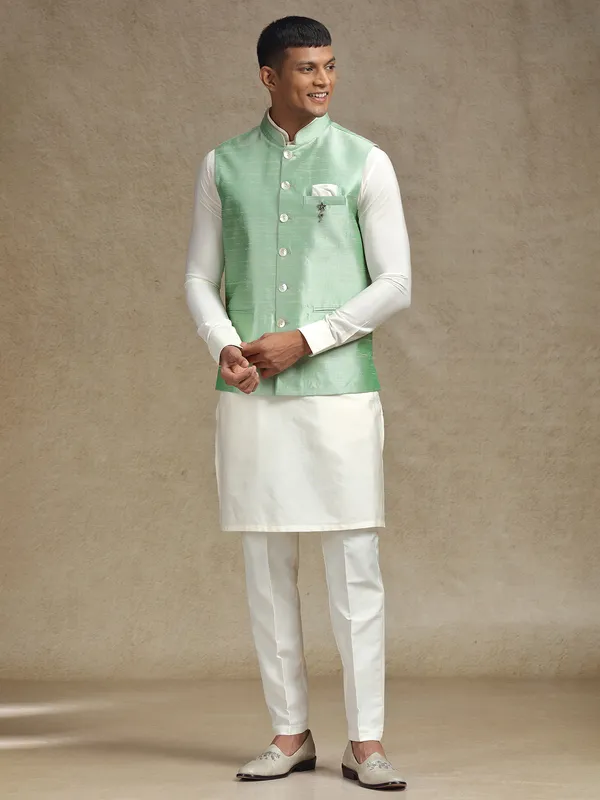 White and light green waistcoat set with intricate embroidery