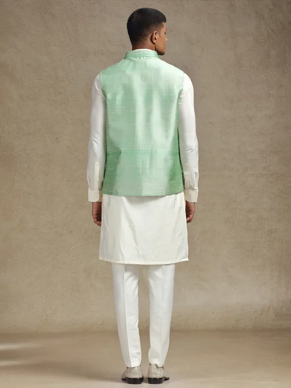 White and light green waistcoat set with intricate embroidery