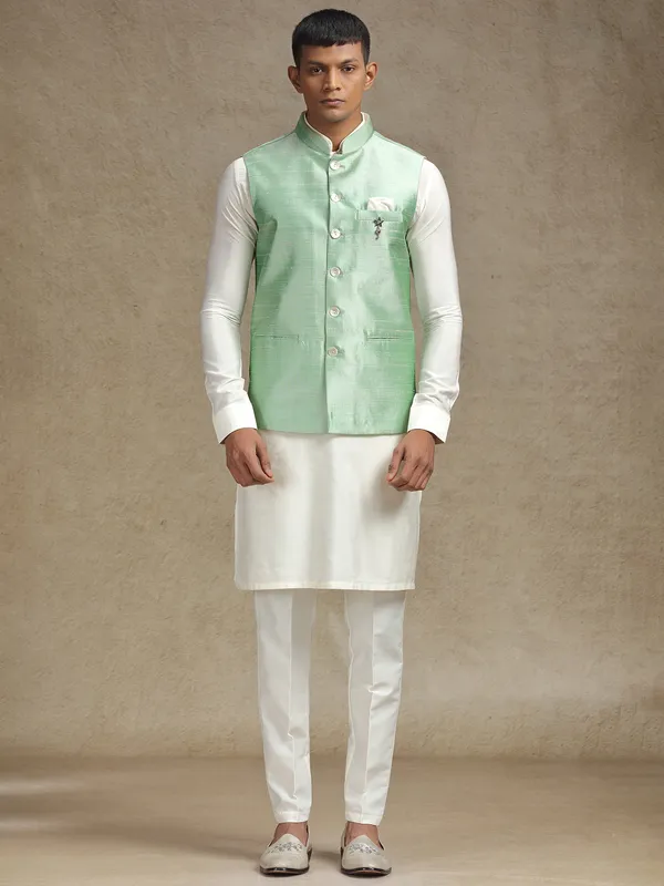 White and light green waistcoat set with intricate embroidery