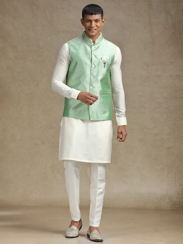 White and light green waistcoat set with intricate embroidery