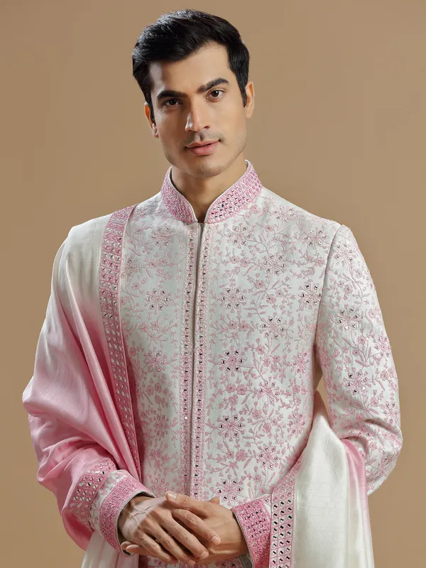 White and pink raw silk sherwani for groom