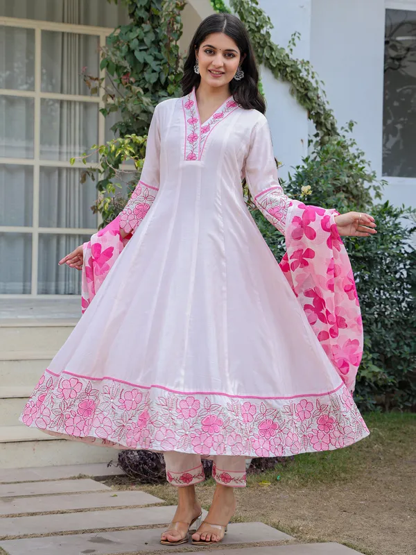 White and pink suit perfect for special celebrations