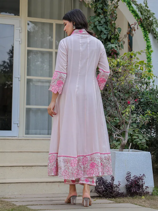 White and pink suit perfect for special celebrations