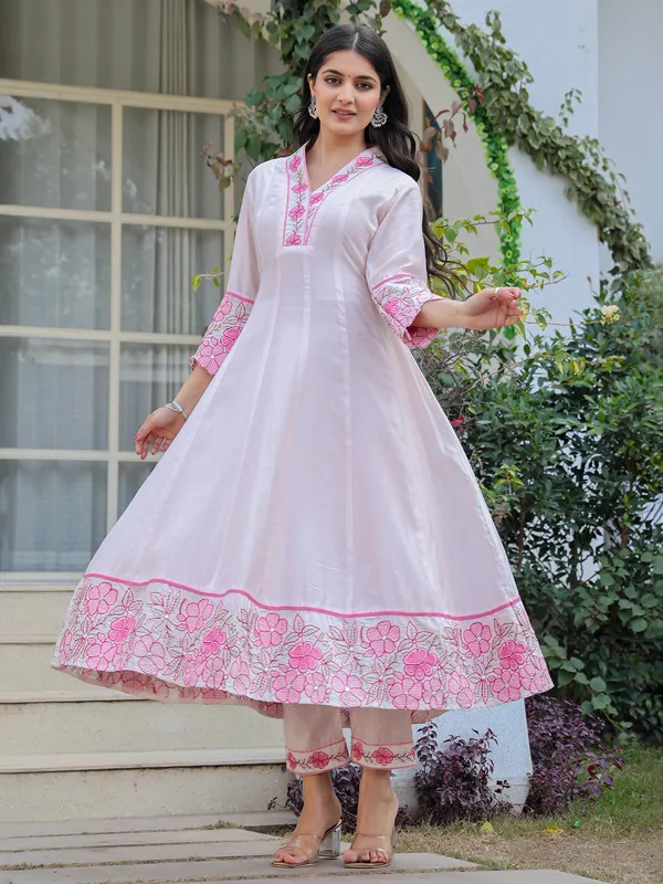 White and pink suit perfect for special celebrations