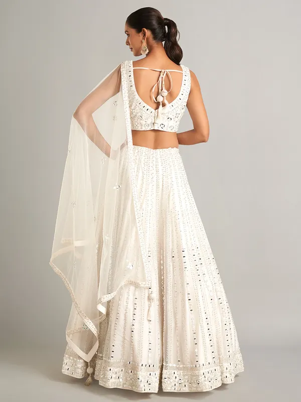 White colored net lehenga choli for wedding