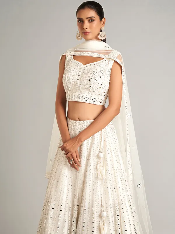 White colored net lehenga choli for wedding