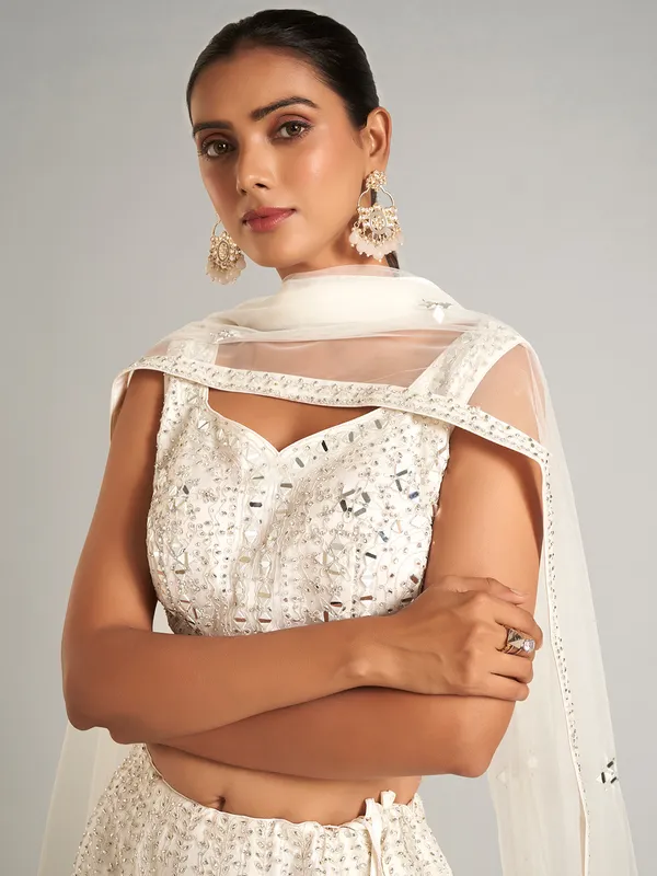White colored net lehenga choli for wedding