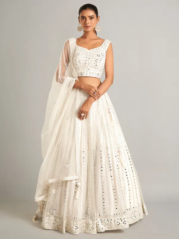 White colored net lehenga choli for wedding