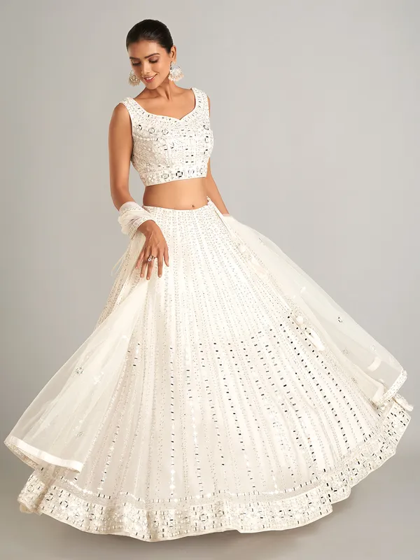 White colored net lehenga choli for wedding