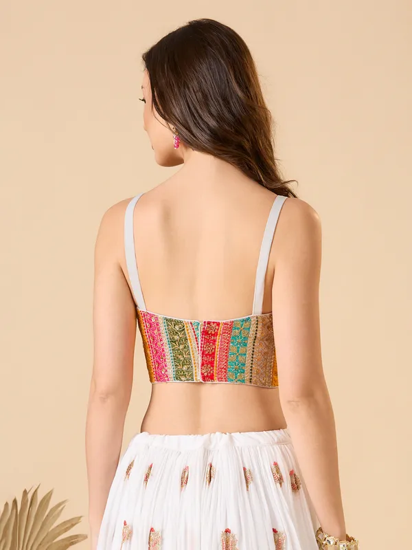 White georgette embroidered and sleeveless ready made blouse