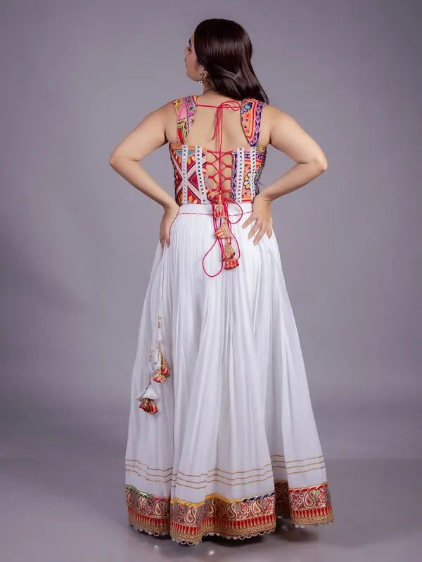 White navratri lehenga choli with embroidered blouse