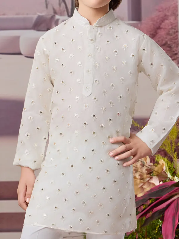 White silk kurta set with subtle glow