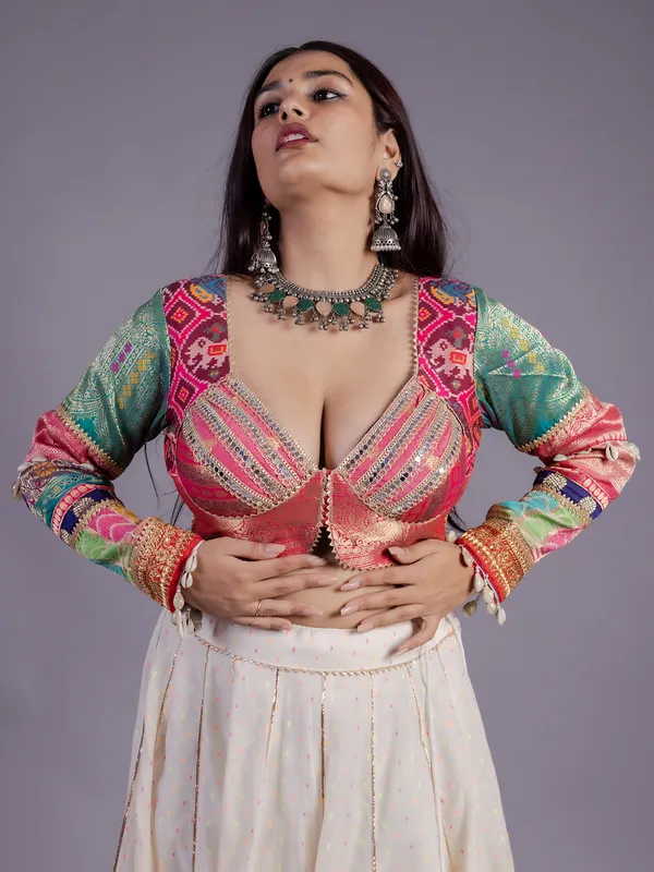 White silk lehenga choli with cowrie shell work