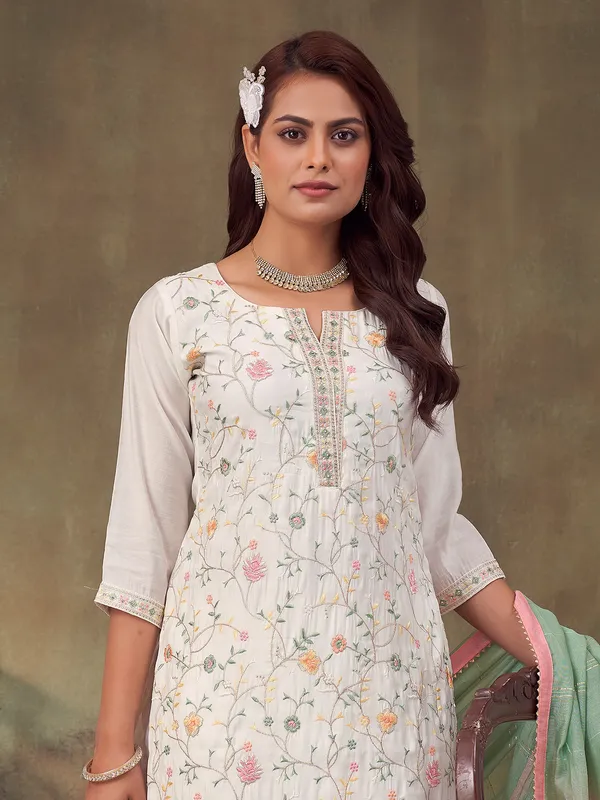 White silk salwar suit with embroidery and dupatta