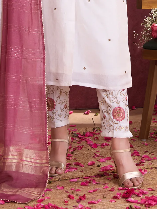 White silk salwar suit with shaded dupatta