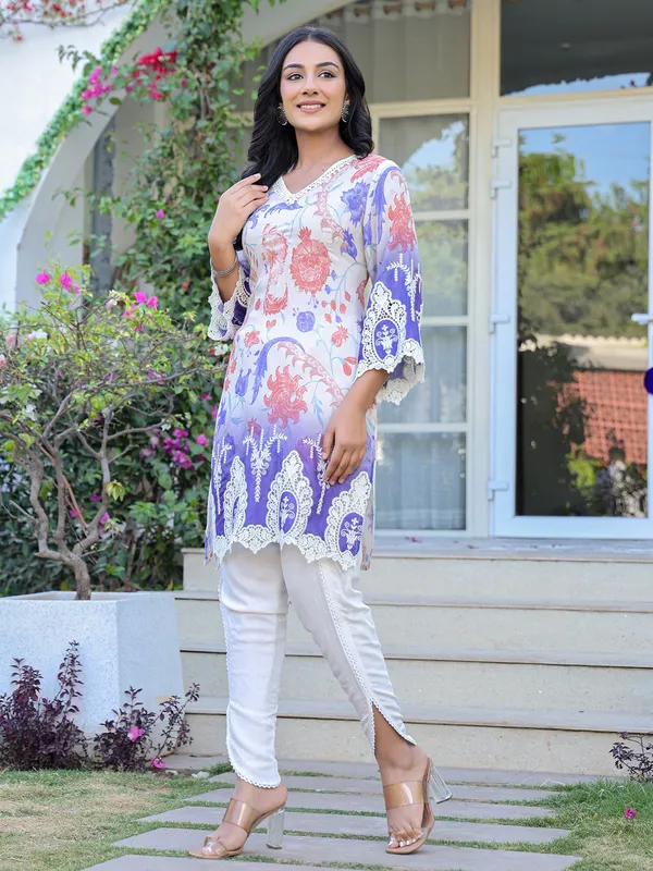 White silk suit with embroidered festive charm