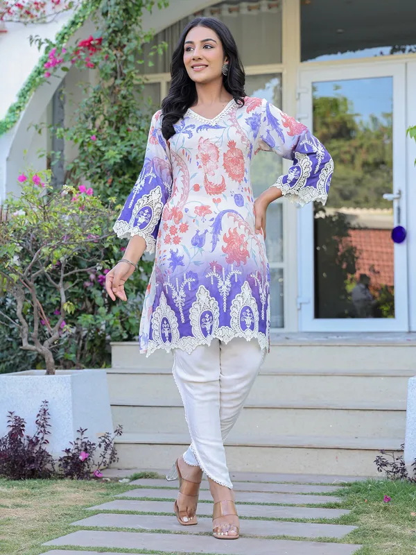 White silk suit with embroidered festive charm
