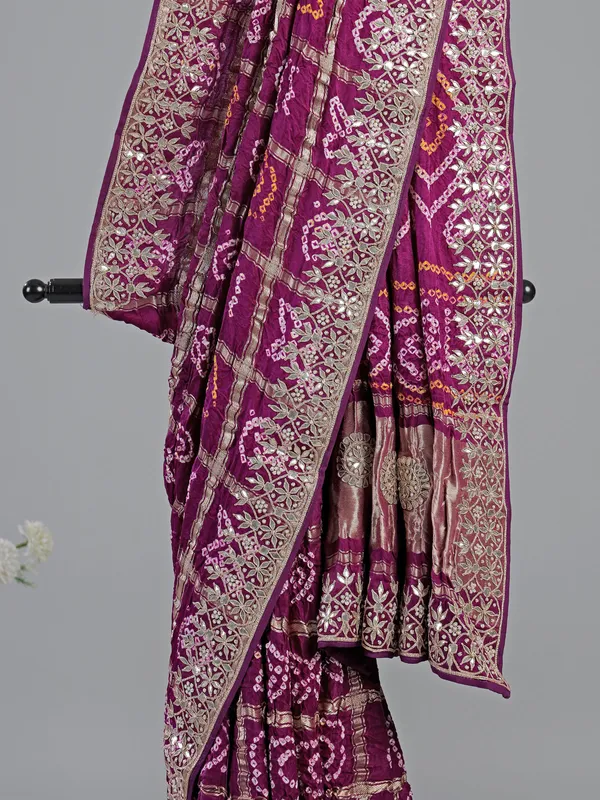 Wine bandhani saree with rich gota work