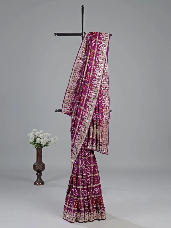 Wine bandhani saree with rich gota work