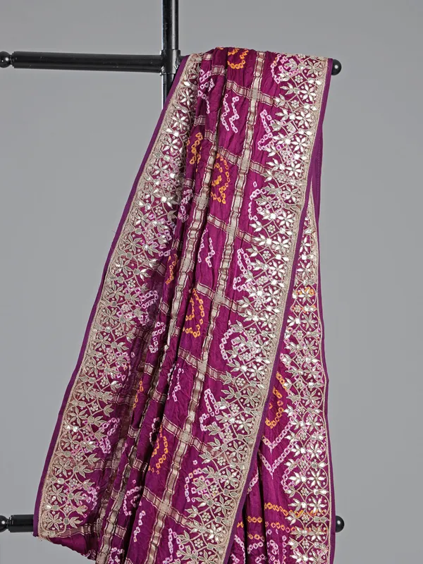 Wine bandhani saree with rich gota work