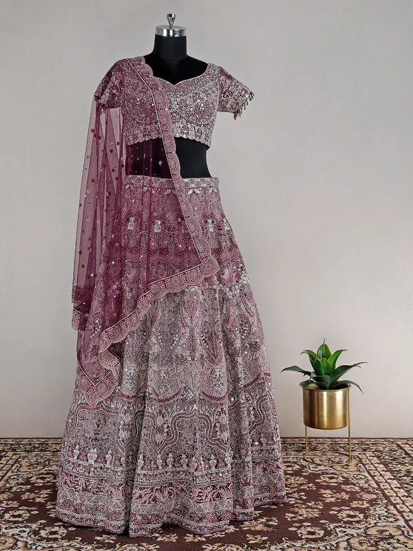 Wine heavy net lehenga choli for reception