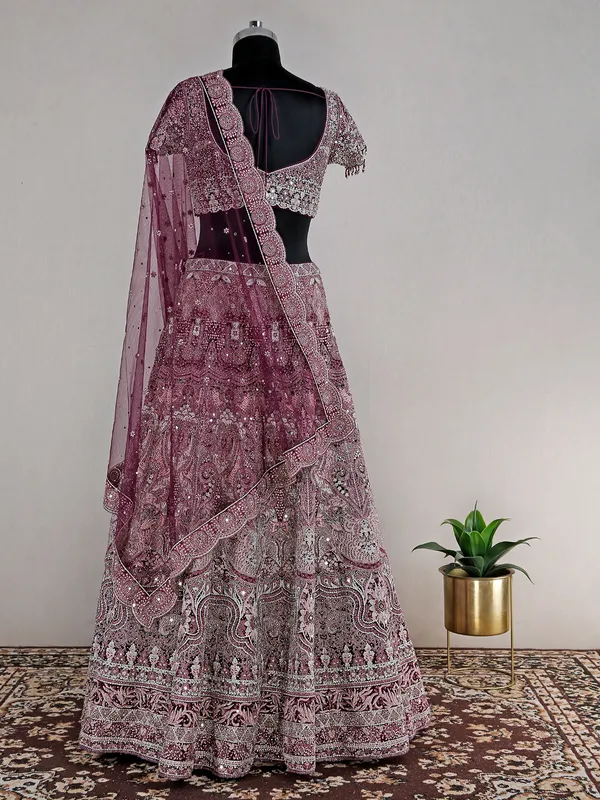 Wine heavy net lehenga choli for reception