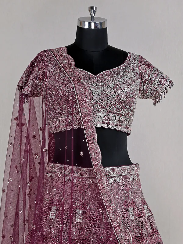Wine heavy net lehenga choli for reception