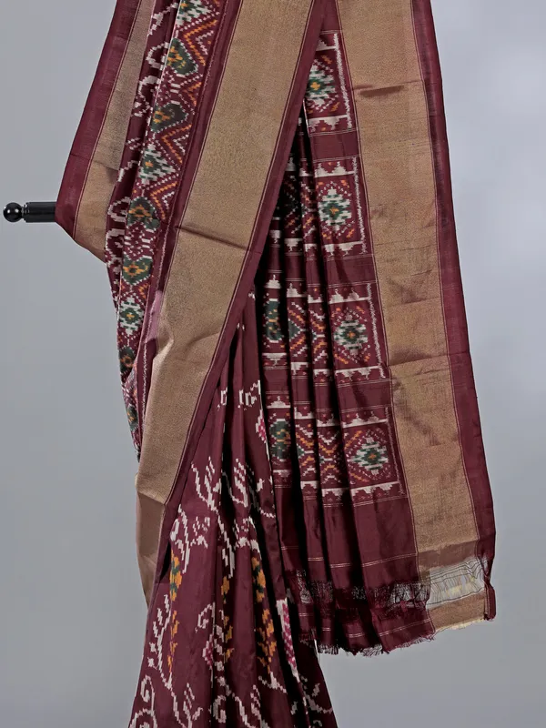 Wine zari weaving patola silk saree with regal prints