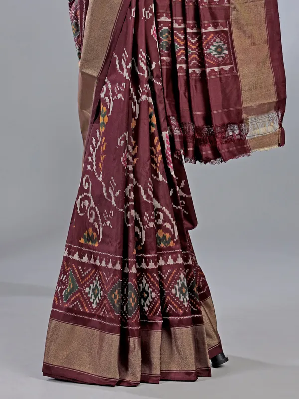Wine zari weaving patola silk saree with regal prints