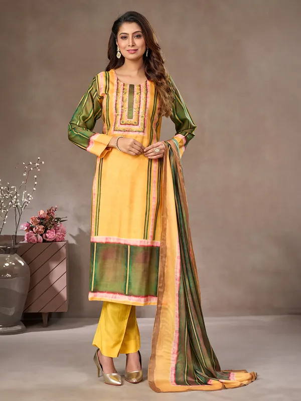 Yellow and green silk salwar suit with embroidered detail