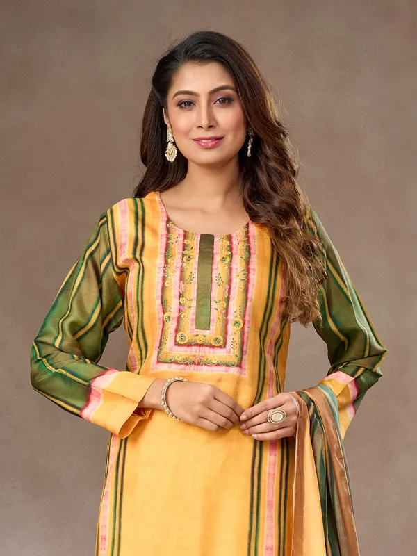 Yellow and green silk salwar suit with embroidered detail