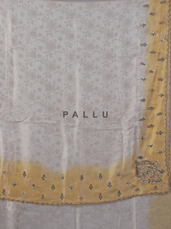 Yellow and off white tissue silk saree for receptions