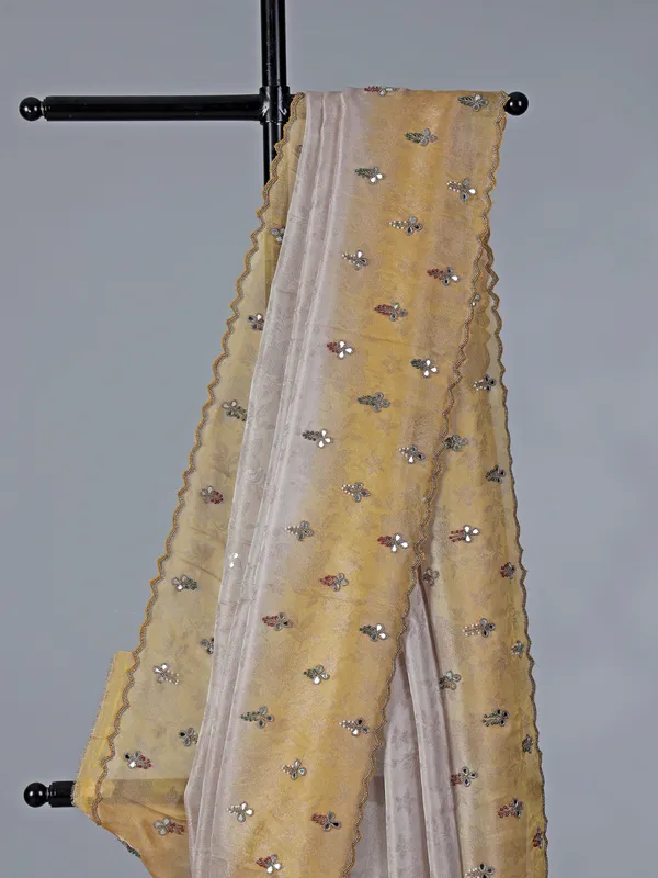 Yellow and off white tissue silk saree for receptions