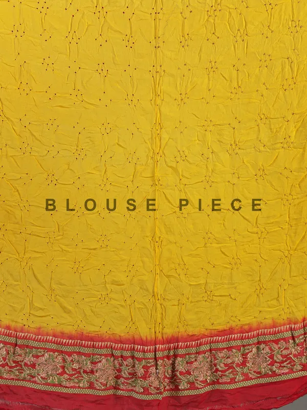 Yellow bandhej silk saree with unstitched blouse