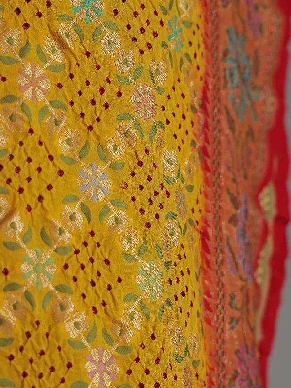 Yellow bandhej silk saree with unstitched blouse