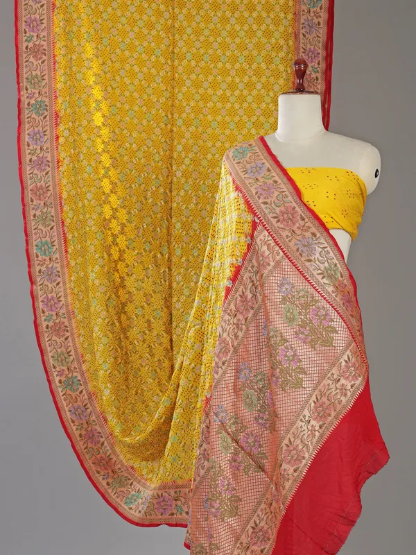 Yellow bandhej silk saree with unstitched blouse
