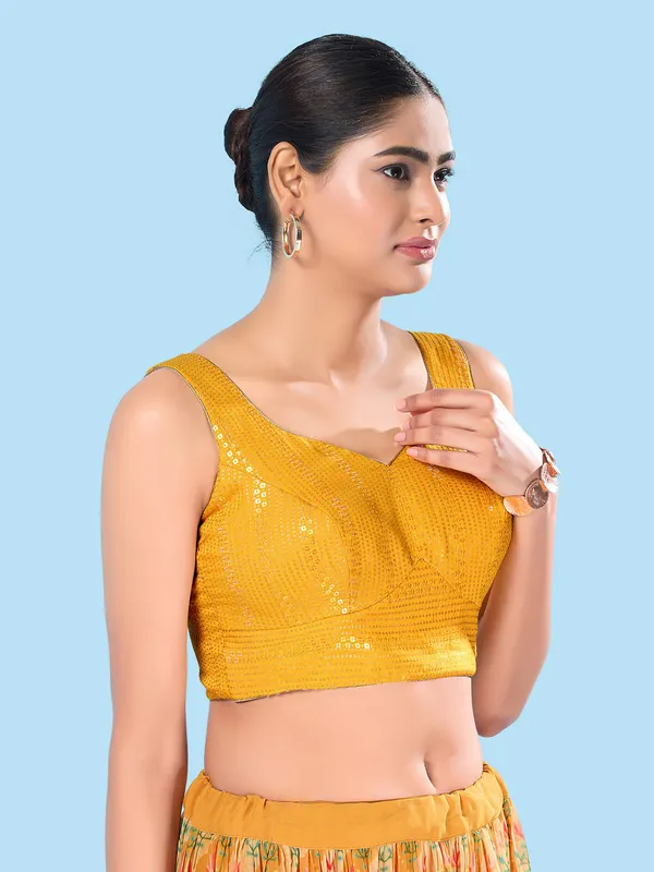 Yellow brocade sleeveless blouse