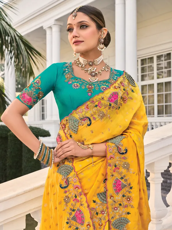 Yellow crape saree with rich festive appeal