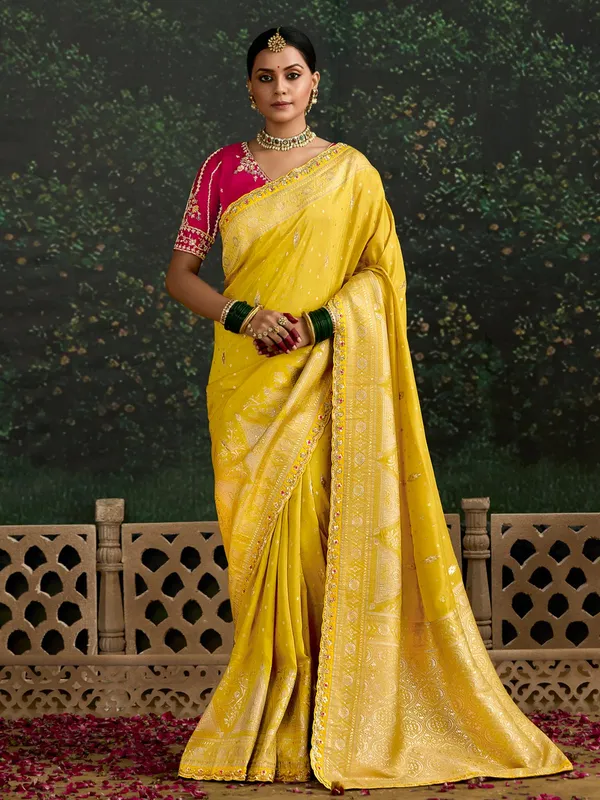 Yellow dola silk saree with bold blouse