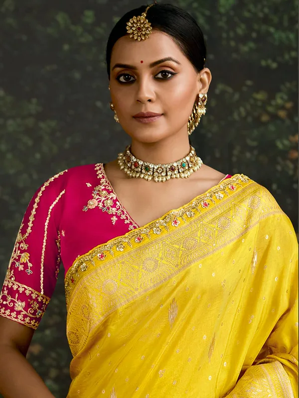 Yellow dola silk saree with bold blouse