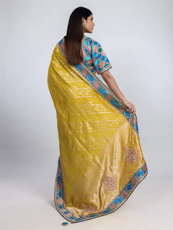Yellow dola silk saree with contrast blue blouse