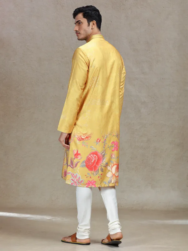 Yellow eye-catching printed kurta suit in tussar silk