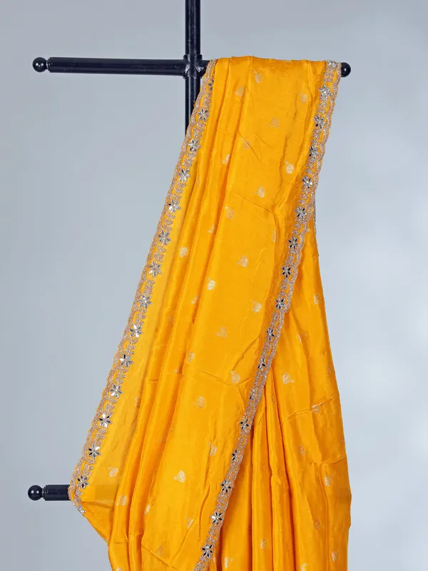 Yellow festive wear dola silk saree with cutdana detailing