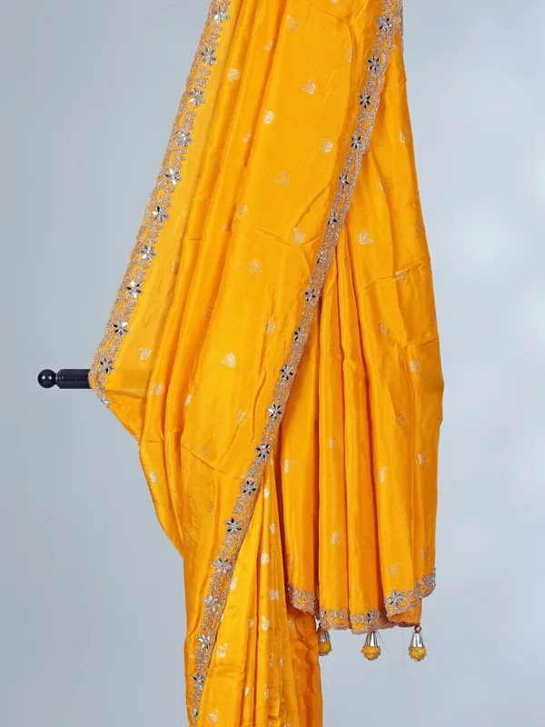 Yellow festive wear dola silk saree with cutdana detailing