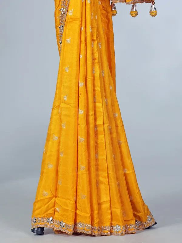 Yellow festive wear dola silk saree with cutdana detailing