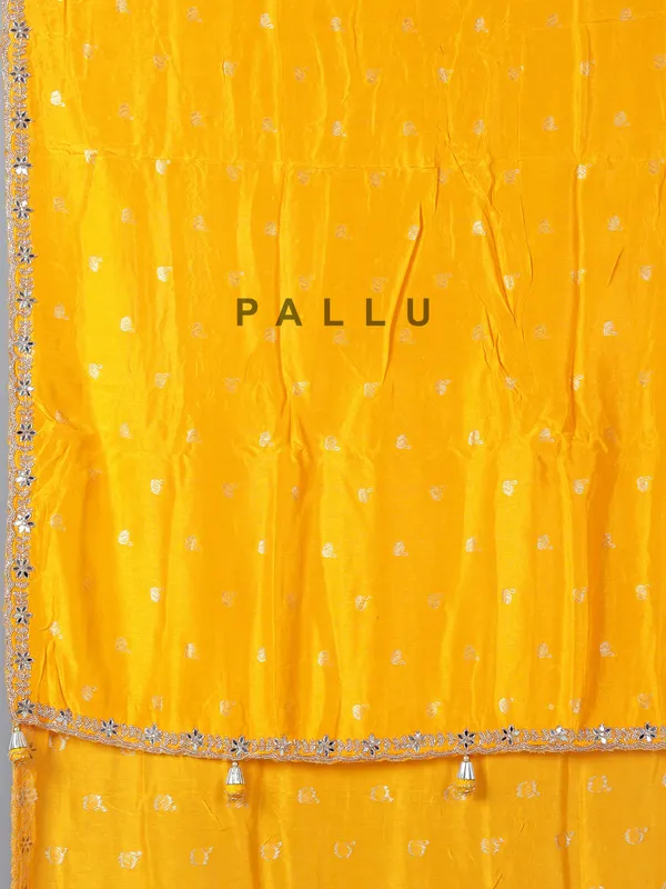 Yellow festive wear dola silk saree with cutdana detailing