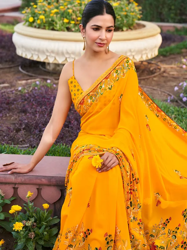 Yellow georgette saree with printed stone detail